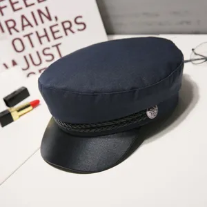Classic navy blue cadet cap with black leather brim and braided band for women chic look.