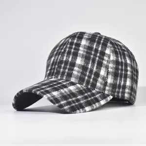 Detail view of the classic black and white plaid baseball cap, winter hat, hard top design.