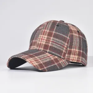 Detailed view of the autumn winter woolen plaid baseball cap, structured hard top, curved brim.