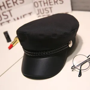Classic black newsboy cap with leather brim and braided strap for women fashion style.
