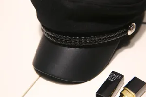 Black octagonal cap detail, retro military style hat with leather brim and braided strap.