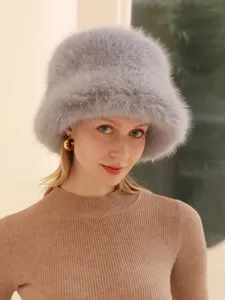 Grey fluffy faux fox fur bucket hat detail view, warm winter cozy fashion style accessory.
