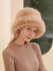 Close up of fluffy camel fox fur winter bucket hat, soft warm plush texture detail view.