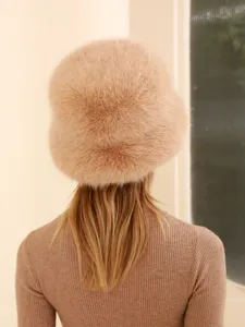 Cozy winter faux fur bucket hat for women, soft plush warm outdoor fashion cap style.