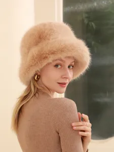 Cozy winter faux fur bucket hat for women, plush warm fuzzy cap in stylish camel color.
