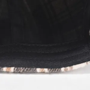 Detail view of the classic plaid baseball cap interior, showing neat stitching and soft fabric.