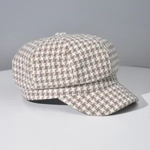 Classic brown houndstooth octagonal cap, stylish retro chic newsboy hat detail view.