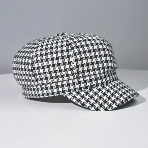 Classic black and white houndstooth newsboy cap, versatile retro beret hat for daily wear.