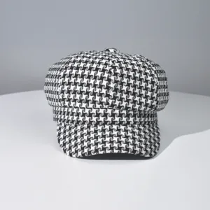 Classic black and white houndstooth newsboy cap, retro vintage style octagonal beret hat.