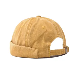 Detail shot of a vintage washed denim docker cap, stylish brimless miki hat for street fashion.