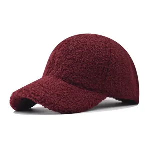 Thick shearling fleece baseball cap closeup showing soft texture and curved brim detail.