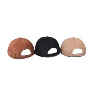 Corduroy docker cap detail showing three colors brown black and khaki with back strap.