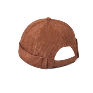 Brown corduroy dockerman hat detail shot, showing the texture and back adjustable strap design.