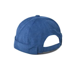 Close-up detail of blue corduroy dockermiki cap, retro brimless street fashion hat back view.