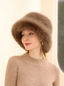 Stylish winter plush bucket hat for women, warm fluffy faux fur cap, cozy outdoor fashion headwear.