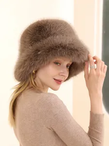 Close-up of cozy brown faux fur bucket hat, soft warm winter headwear detail view.