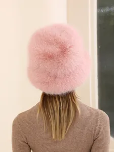 Pink fluffy fur bucket hat detail showcasing soft plush texture and warm winter design.