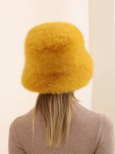 Cozy winter fur bucket hat detail, fluffy texture, warm outdoor fashion headwear for women.