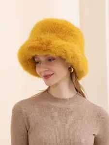 Stylish yellow faux fur bucket hat for women, cozy winter warm plush cap for outdoor wear.