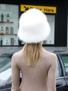 White fur bucket hat detail, fluffy winter warm cap, stylish outdoor soft headwear.