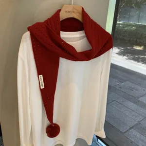 Red knit triangle scarf for women, hollow design with pom-pom, wool blend winter shawl.