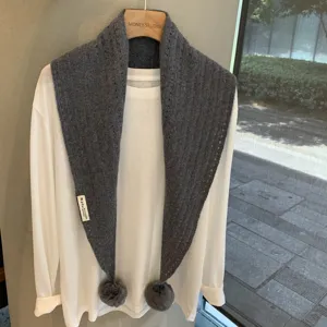 Grey knitted triangular scarf with pom poms, wool cashmere blend winter warm shawl fashion.