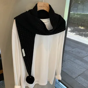 Black hollow knit triangular scarf with pom pom detail, chic fashion wool shawl for women.