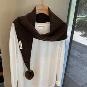 Brown knitted wool triangular scarf with pom-pom and hollow-out design for women.