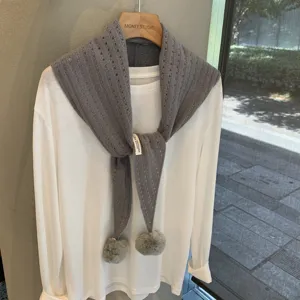 Grey knit triangular scarf with pom-poms, wool blend hollow shawl for women autumn winter fashion.