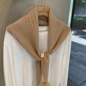 Detailed view of women hollow wool triangular scarf, stylish knitted layering shawl accessory.