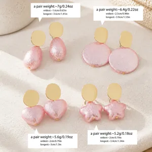 Pink pearlized textured geometric earrings set including teardrop round heart star shapes.