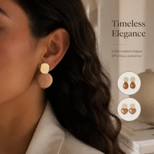 Geometric textured drop earrings detail showing vintage metallic finish and elegant shapes.