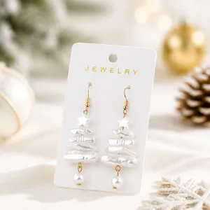 Christmas irregular pearl tree earrings detail view, festive star pendant jewelry decor.