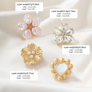 Detail shot of french vintage gold floral pearl cufflinks and shirt decorative accessories set.