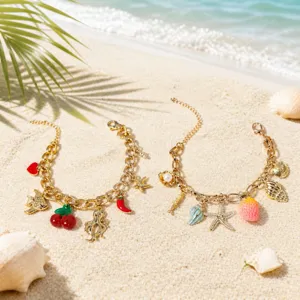 Detailed view of gold chain charm bracelets featuring summer beach elements like shells and starfish.