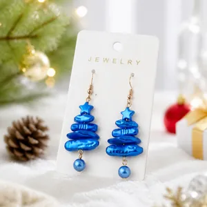 Blue imitation pearl Christmas tree earrings detail, sparkling holiday style drop earrings.