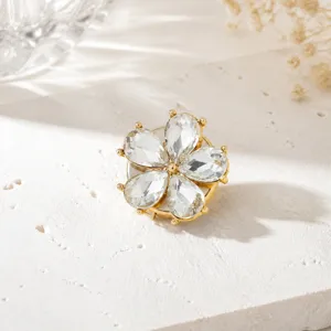 Exquisite crystal flower shirt accessory, elegant gold-tone rhinestone detail shot.