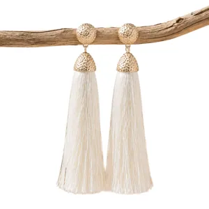 Bohemian long tassel earrings with textured gold metal stud and elegant off white fringe design.