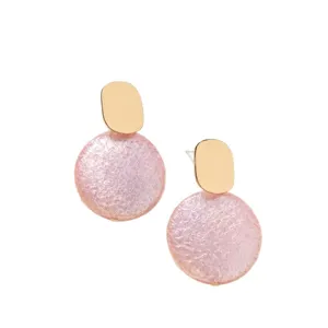 Pink pearlized geometric stud earrings featuring gold oval and textured round drop design.