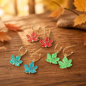 Chic enamel maple leaf hoop earrings with retro gold edge, perfect for autumn style fashion jewelry.