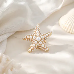 Exquisite pearl starfish cufflink detail shot, elegant gold accessory for shirts.