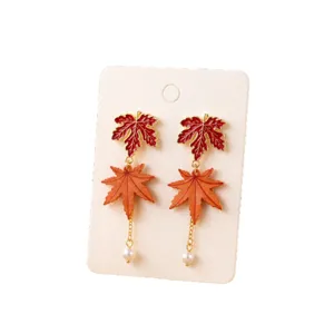 Autumn maple leaf pearl dangle earrings, long tassel design, elegant autumn fashion jewelry.