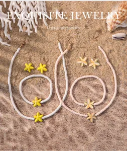 Gedetailleerd uitzicht strand vakantie stijl zachte klei zeester ketting armband oorbellen set.