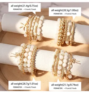 Set di bracciali multistrato con perle occhio di gatto e ciondoli a forma di stella marina.