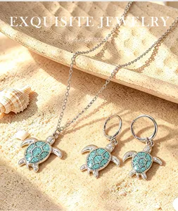 Exquisite turquoise sea turtle jewelry set close-up, silver necklace and matching earrings