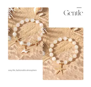 Charmantes rosa Perlenarmband mit süßem Seesternanhänger für eleganten Strandschmuck.