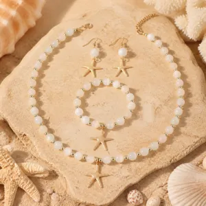 Detailansicht des perlenbesetzten Seestern Halskette, Armband und Ohrringe Schmucksets.