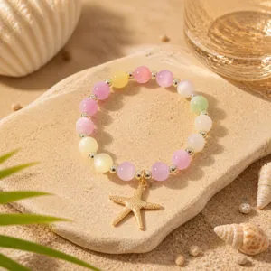 Buntes Katzenauge Perlenarmband mit Seestern Anhänger Damen Schmuck Detailansicht.