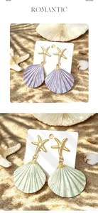 Beach resort style colored shell earrings with gold starfish, chic summer vacation jewelry.