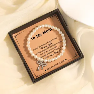 Zoete kunstparel armband met strass strik en mooie moederdag geschenkdoos kaart set.